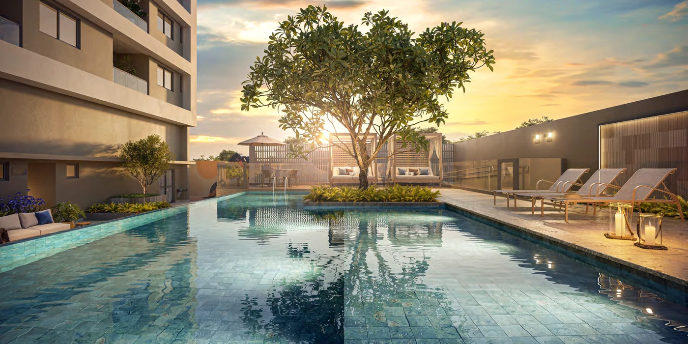 Piscina com prainha e solarium do Albor Residence ao pôr do sol